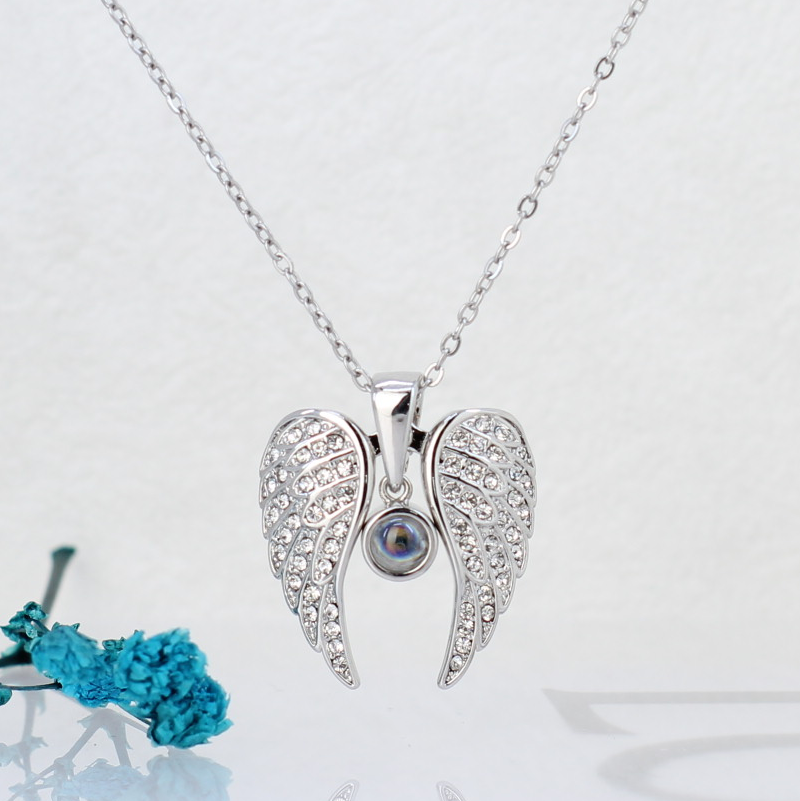 Personalized custom photo necklace - Heart-shaped wing pendant with a photo inside the stone, which can be unfolded