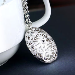 High-Quality Platinum-Plated Oval Photo Locket Necklace - Hollow Vintage Celtic Star Flowers Design, Custom Photo & Text, Memory Gifts for Men Women